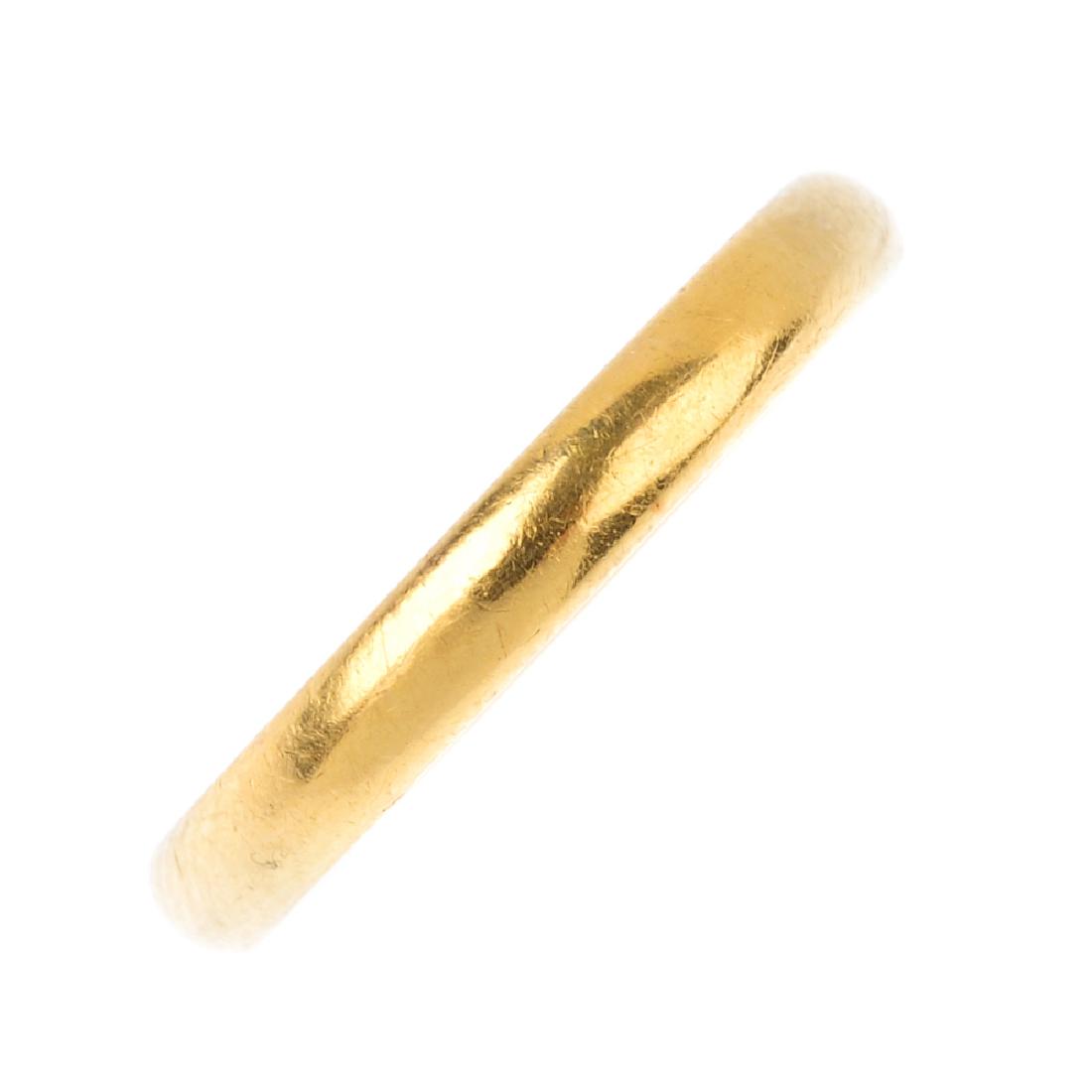 A mid 20th century 22ct gold band ring. Hallmarks for (1 of 3)