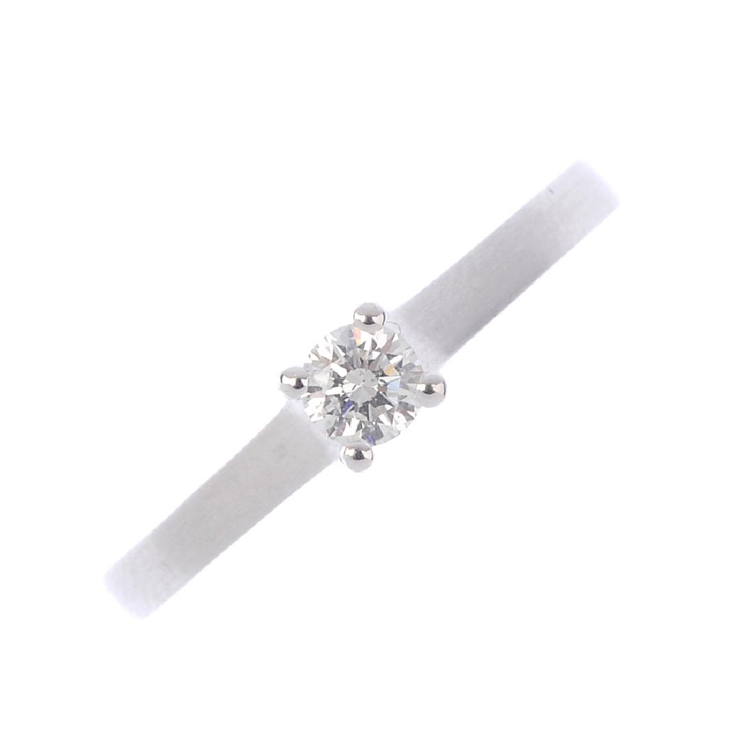 A 14ct gold diamond single-stone ring. The (1 of 3)