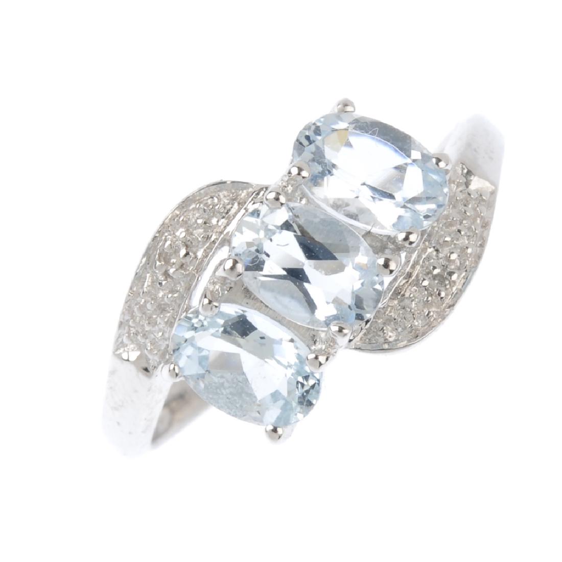 A 9ct gold aquamarine and diamond ring. The oval-shape (1 of 3)