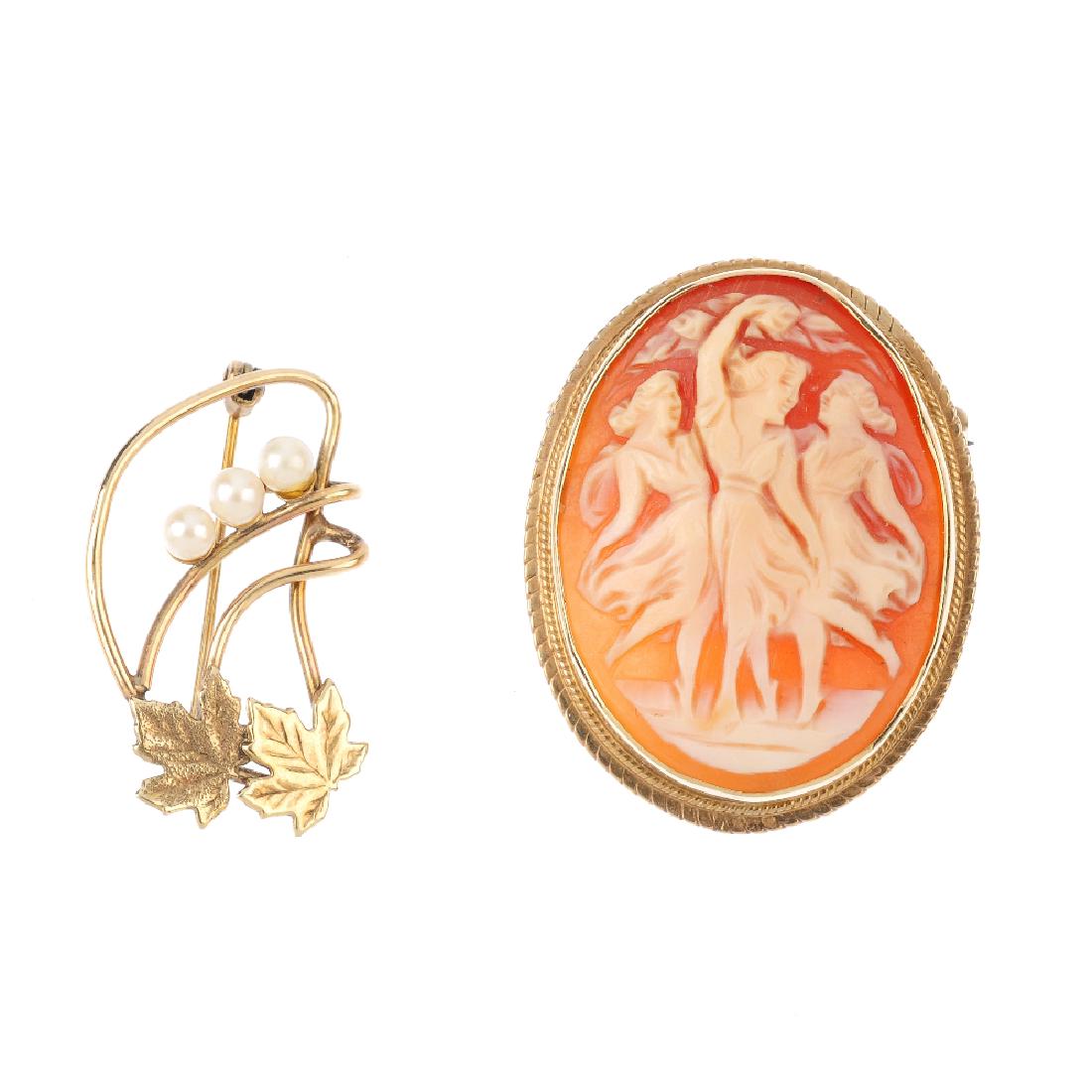 Two brooches. The first an oval shape cameo carved to (1 of 2)