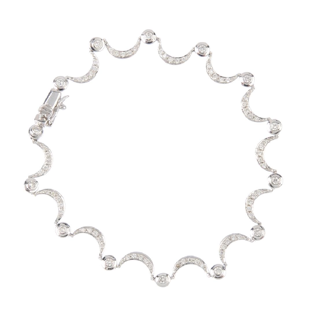 An 18ct gold diamond bracelet. Designed as a series of (1 of 2)