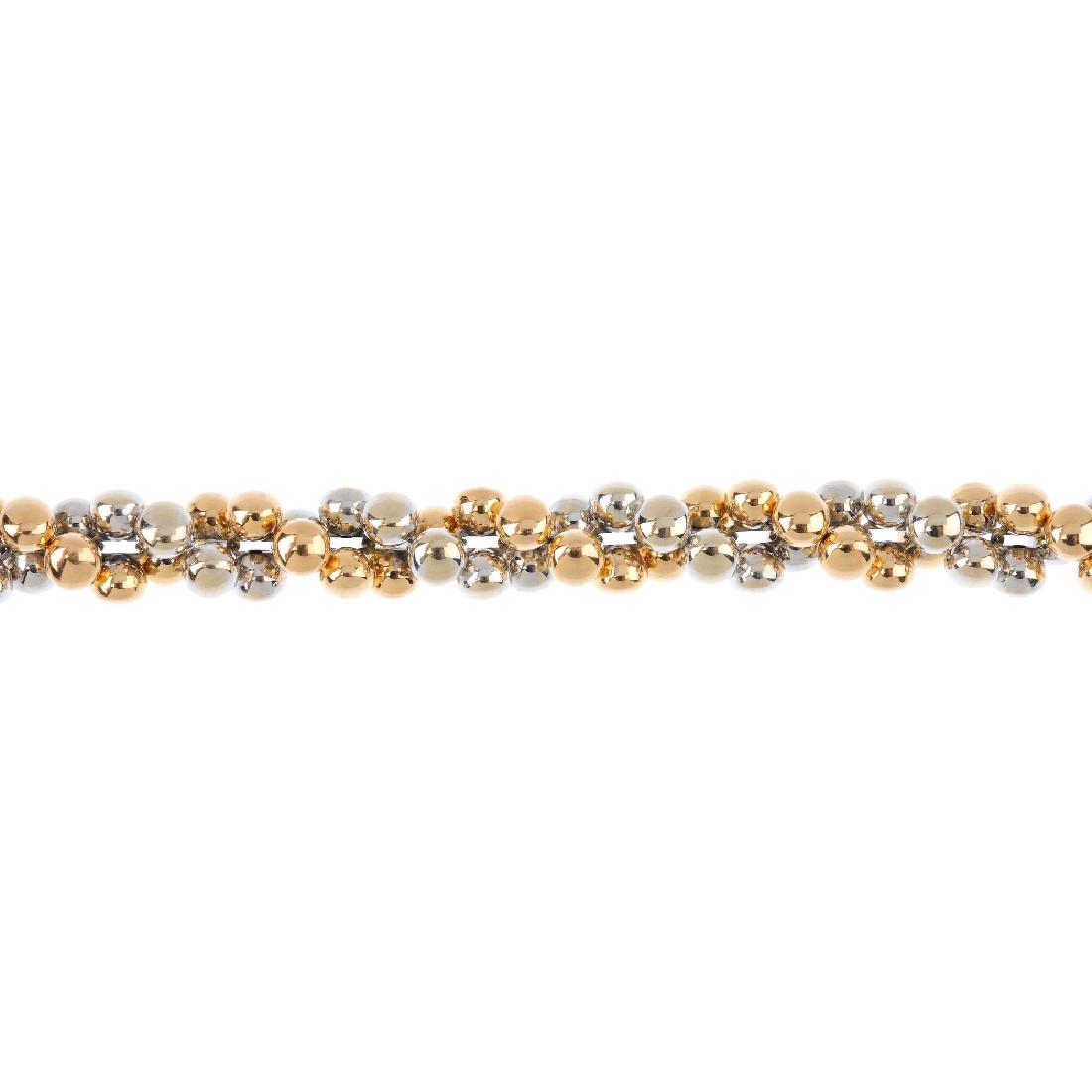 CHIMENTO - an 18ct gold bracelet. Designed as a series: CHIMENTO - an 18ct gold bracelet. Designed as a series of bi-colour beads, with brilliant-cut diamond accent clasp. Signed Chimento. Hallmarks for London. Length 20.5cms. Weight 21.7gms.