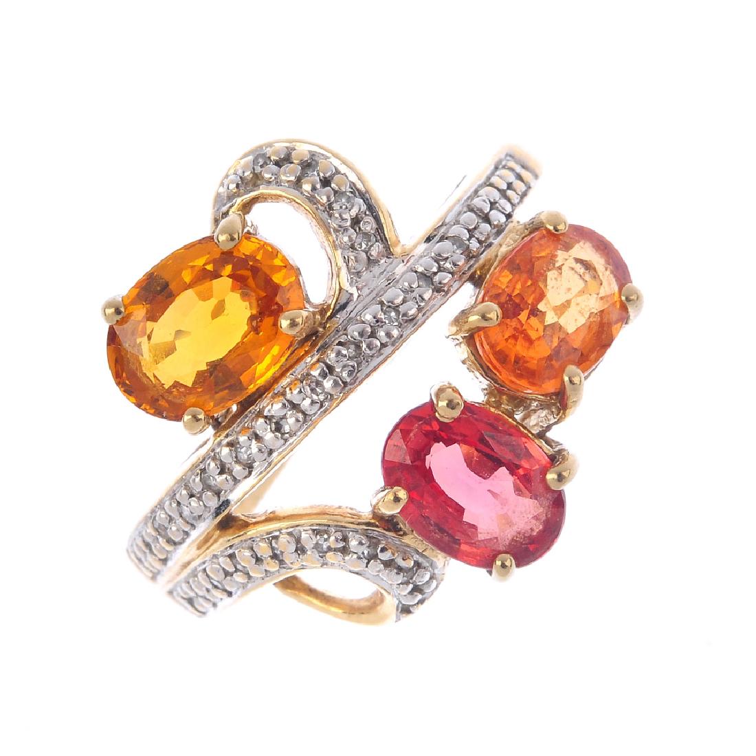 A 9ct gold diamond and gem-set ring. The oval-shape (1 of 4)