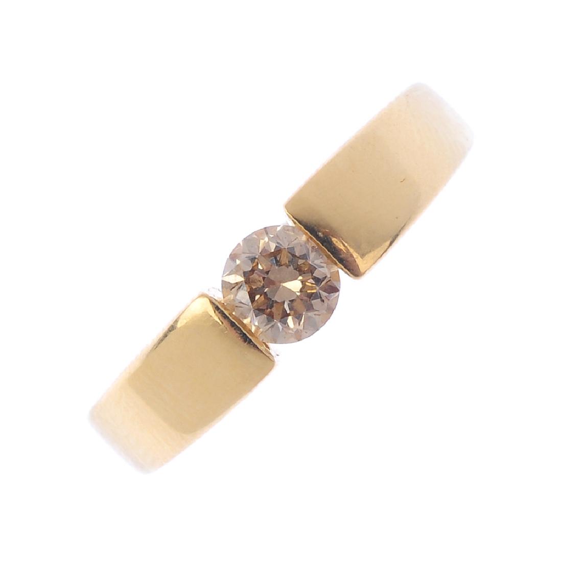 An 18ct gold diamond single-stone ring. The (1 of 3)