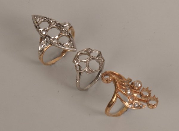 Three diamond set rings, to include a marquise shap