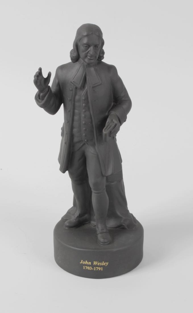 Three Wedgwood black basalt figures, the first modelled: Three Wedgwood black basalt figures, the first modelled as William Shakespeare, the second as Admiral Nelson and the third as John Wesley, each with marks to base, largest 9.25 (23.5cm) high.