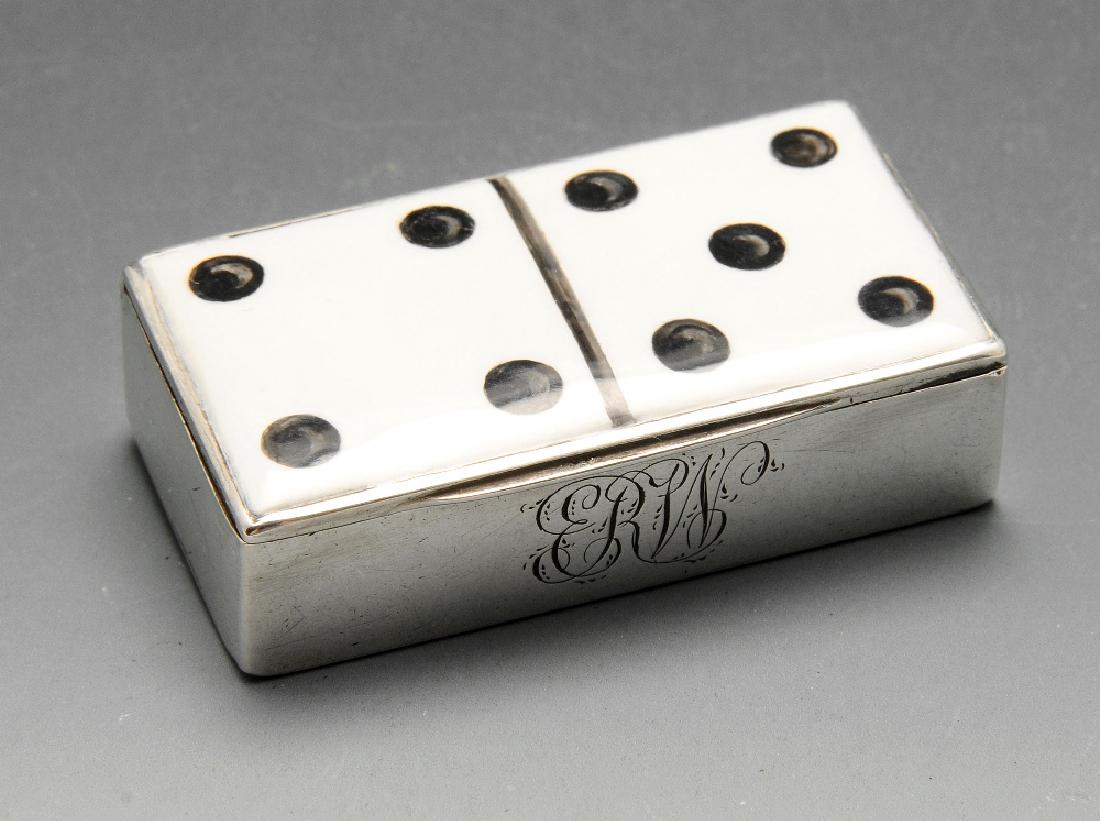 A Victorian novelty silver vesta box, the oblong from: A Victorian novelty silver vesta box, the oblong from with monogram engraving and hinged cover with Domino enamel decoration. Hallmarked Thomas Johnson II, London 1885. Length measuring 5 cm, weight 3