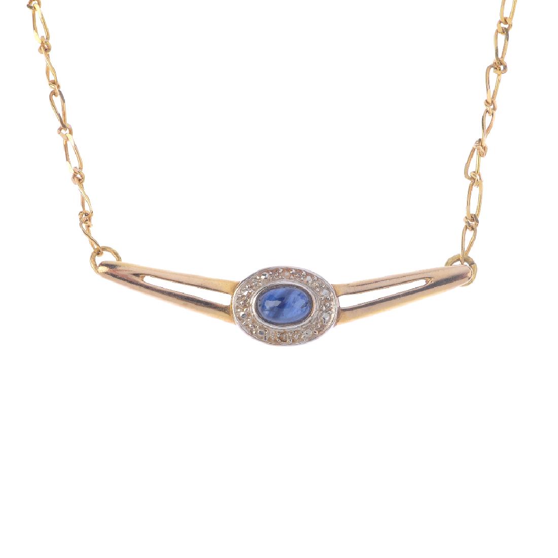 A sapphire and diamond necklace. The oval sapphire (1 of 3)