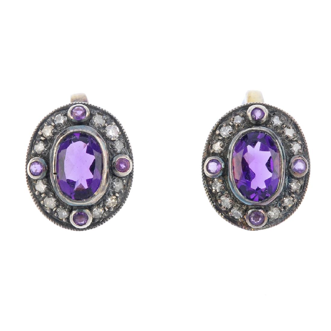 A pair of amethyst and diamond earrings. Each designed (1 of 2)