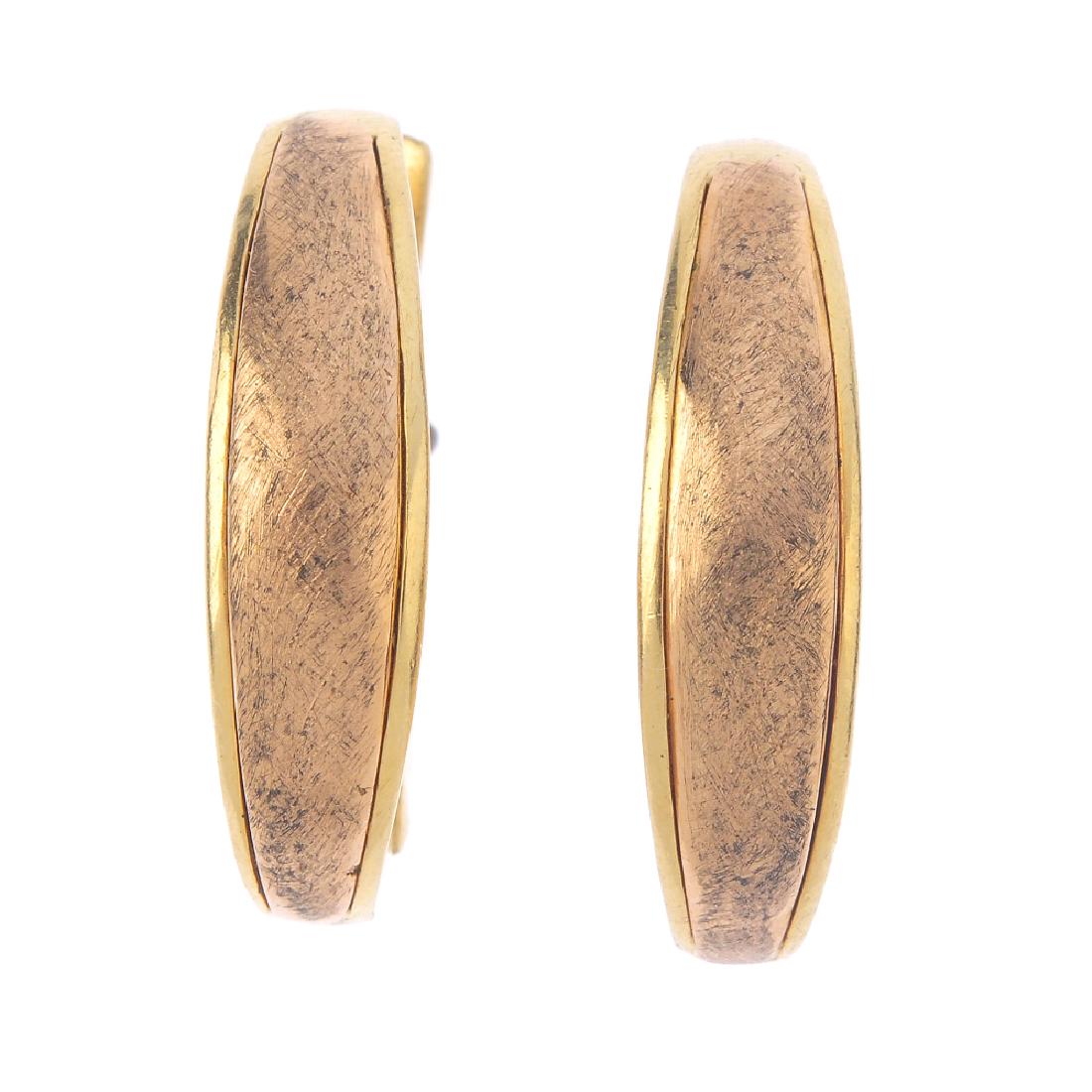 CHIMENTO - a pair of 18ct gold earrings. Each designed: CHIMENTO - a pair of 18ct gold earrings. Each designed as a textured, tapered hoop, with raised sides. Signed Chimento. Hallmarks for London, 2007. Length 2.6cms. Weight 18.8gms.
