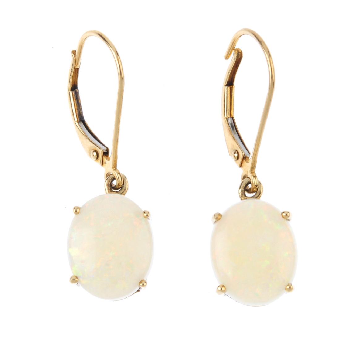 A pair of 9ct gold opal earrings. Each designed as an (1 of 2)
