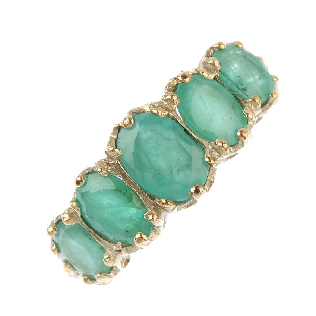 A 9ct gold emerald five-stone ring. The graduated (1 of 3)