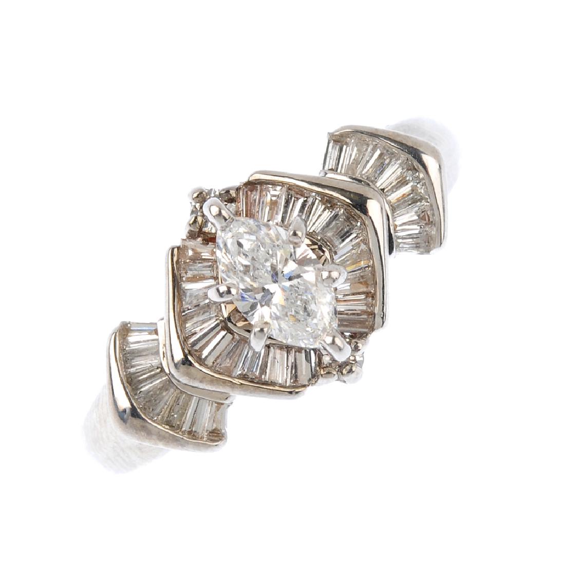 A diamond dress ring. The marquise-shape diamond, (1 of 3)