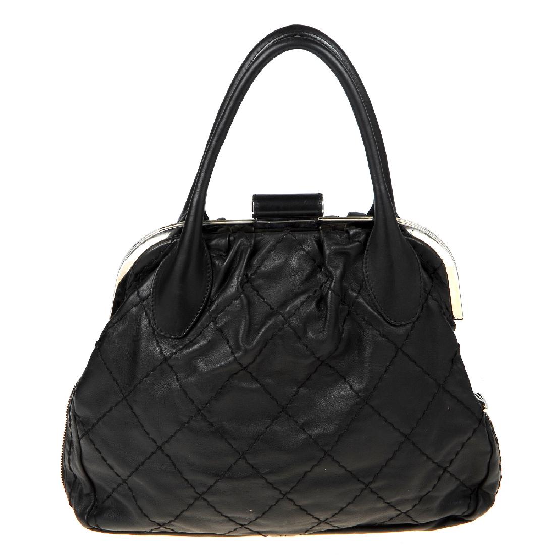 CHANEL - an Expandable Frame Stitch handbag. Crafted (1 of 8)