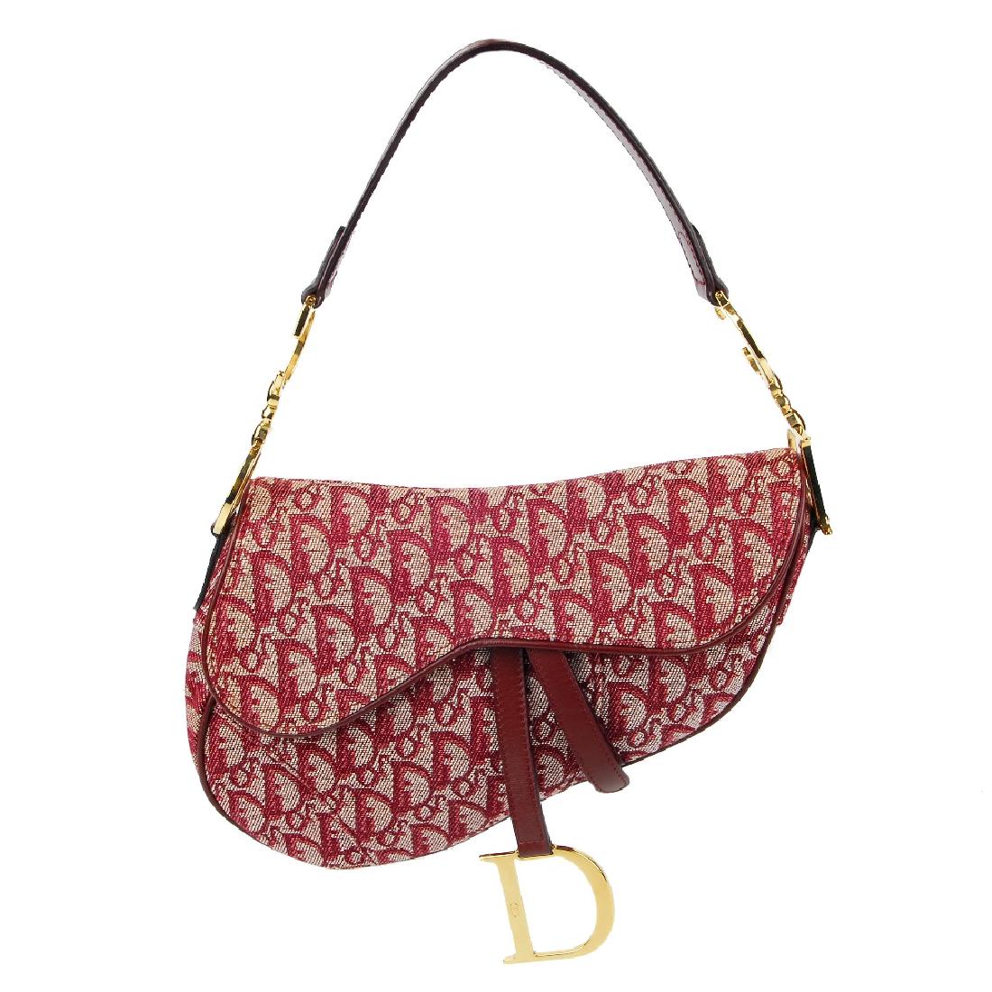 CHRISTIAN DIOR - a pink canvas saddle handbag. (1 of 5)