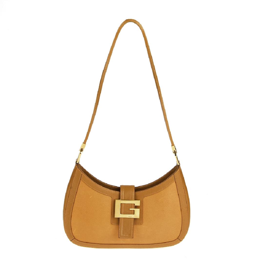 GUCCI - a tan leather handbag. Designed with a lightly (1 of 7)