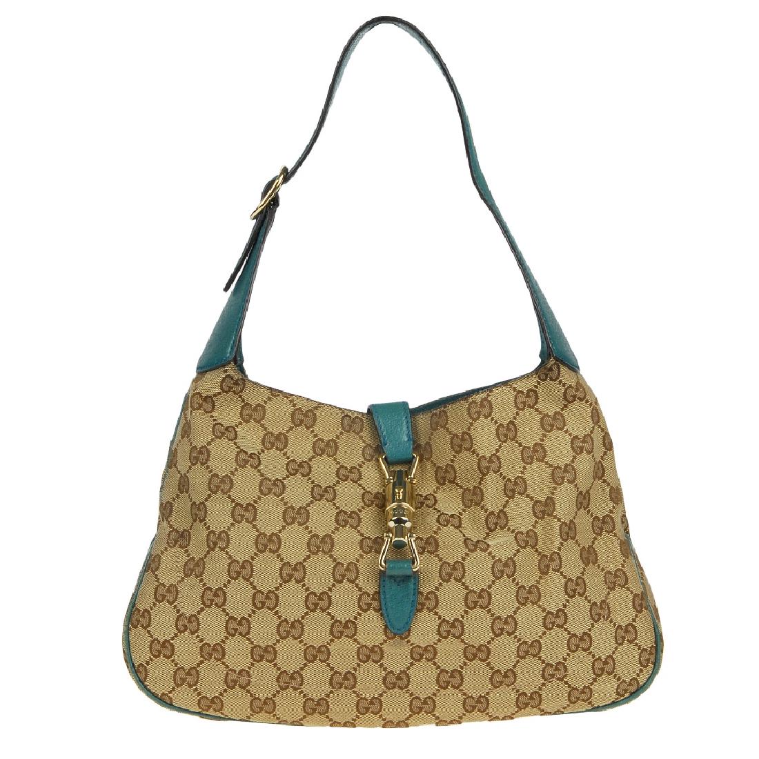 GUCCI - a Jackie handbag. Featuring maker's GG canvas (1 of 7)