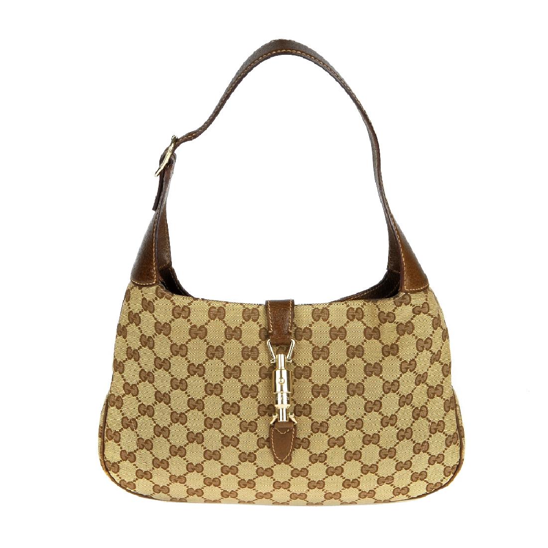 GUCCI - a Jackie handbag. Featuring maker's GG canvas (1 of 7)