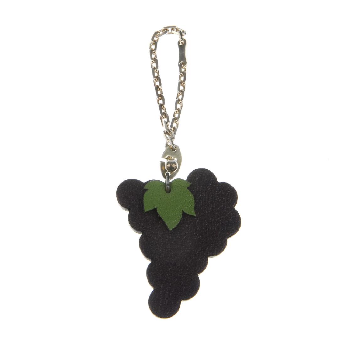 HERMÈS - a fruit key chain. Designed as purple leather (1 of 3)