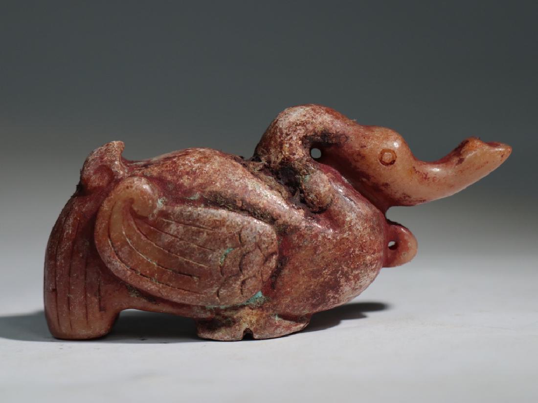 A HETIAN JADE BIRD: A Hetian jade bird:Length 7.5cm Width 3.0cm Height:2.3cm Weight:64g