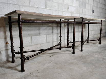 Pair Of Bronzed Forged Steel Consoles In The Manner Of Diego Giacometti: Size 52 1/2in W x 22in D x 31 1/2 in H. Rare important pair of bronzed forged steel consoles. Heavy solid bases with cement tops. Removable tops both slightly sloped towards each other.