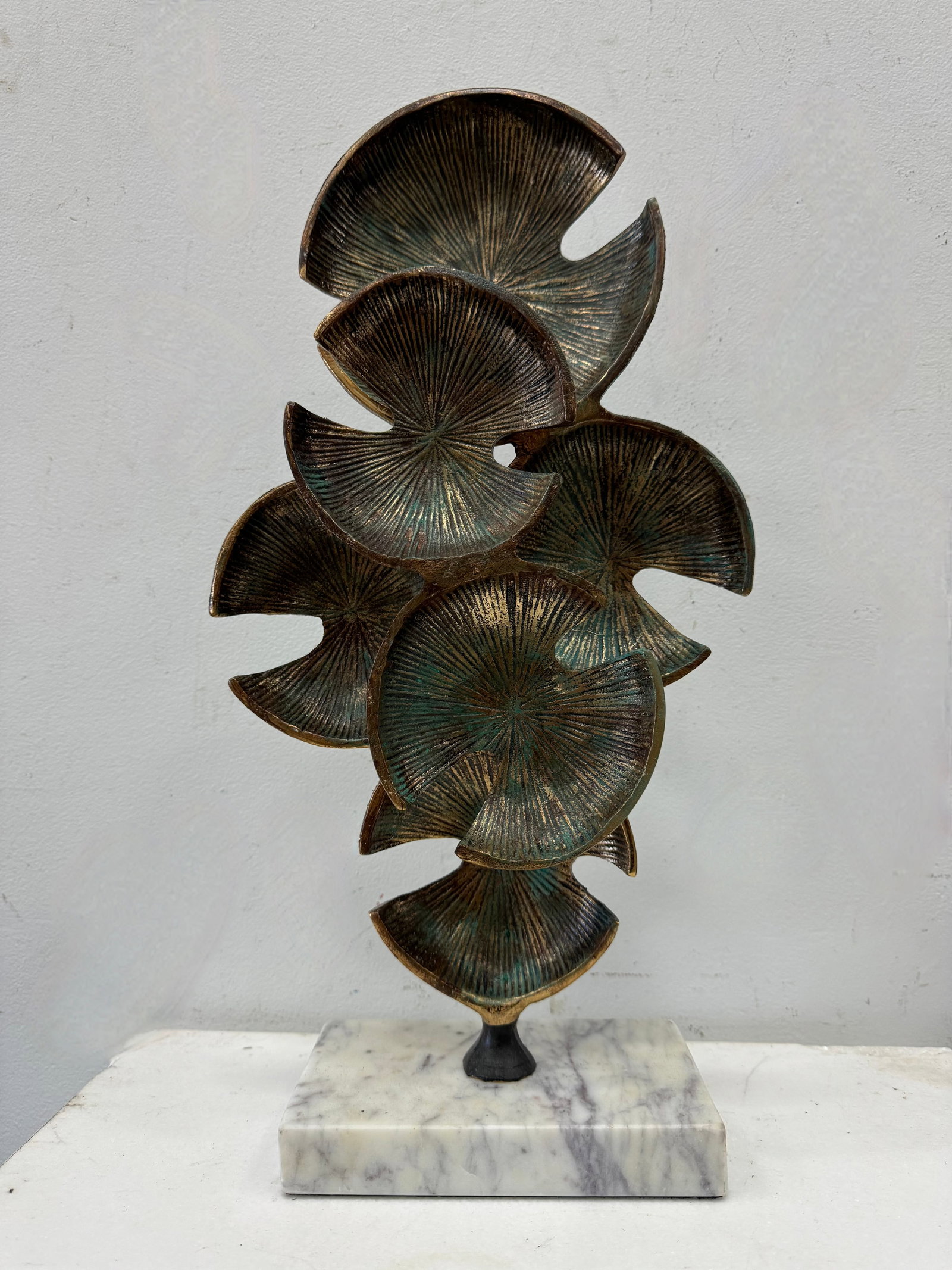 Contemporary Metal Sand Dollar Sculpture: 18.5 x 7 x 4 in