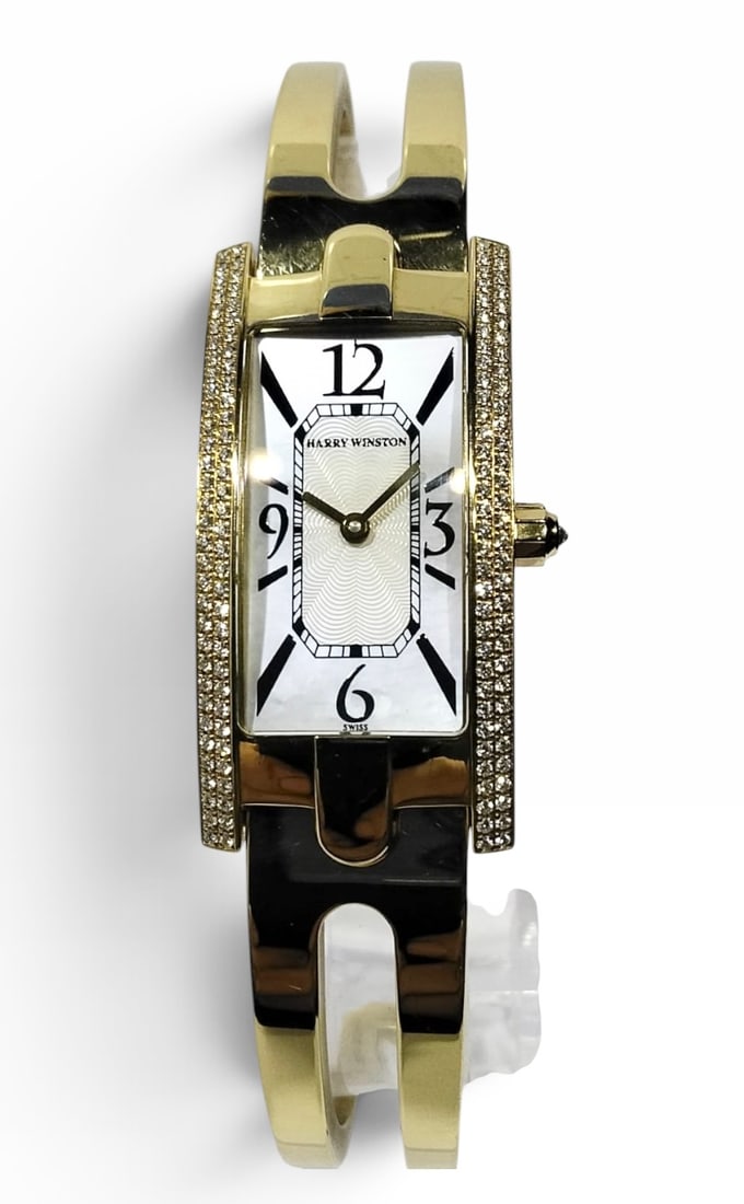 Harry Winston 18 Carat Gold and Diamond Ladies Bangle Watch: Harry Winston Avenue reference 330 LQG, 18 karat ladies gold wrist watch. White mother of pearl dial, with alternating black Arabic numeral and baton hour markers, 18 karat yellow gold 19 mm case, bez