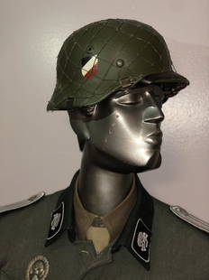 GERMAN WW2 1st INFANTRY DIVISION WEHRMACHT HELMET WITH: GERMAN WW2 1st INFANTRY DIVISION WEHRMACHT HELMET WITH CHICKEN WIRE. HELMET IS IN GOOD OVERALL SHAPE AND CONDITION. HELMET APPEARS TO BE FROM THE 3RD REICH, THE INVASION OF POLAND THEN FRANCE.