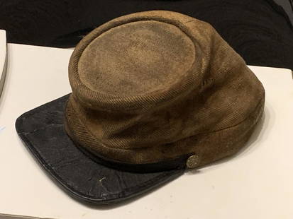 RARE CIVIL WAR CONFEDERATE BUTTNUT KEPI: RARE CIVIL WAR CONFEDERATE BUTTNUT KEPI. IN GREAT SHAPE AND OVERALL CONDITION FOR ITS AGE. HAS A BEAUTIFUL OVERALL ATTIC PATINA. FOUND IN AN ESTATE IN THE ATTIC IN A TRUNK. A RARE FIND. PLEASE VIEW