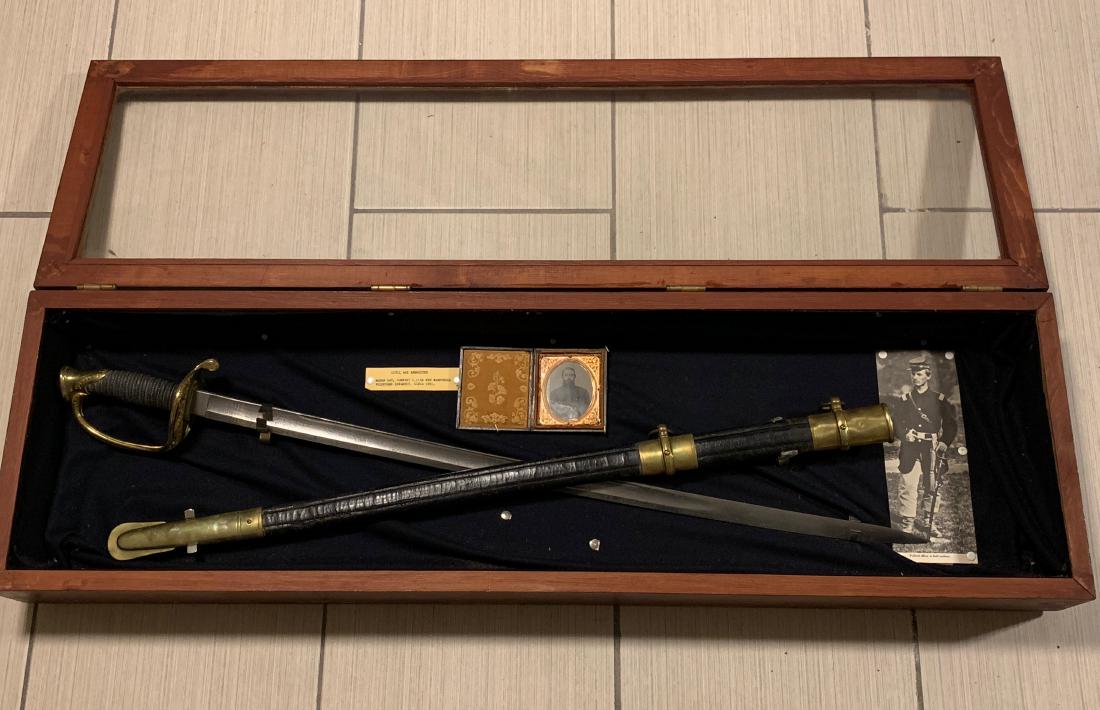 IDENTIFIED CIVIL WAR INFANTRY OFFICERS SWORD - MOSES,: IDENTIFIED CIVIL WAR INFANTRY OFFICER "MR. MOSES, GAY'S" SWORD. COMES PRESERVED IN THE PICTURED CASE. HAS THE OFFICERS AMBROTYPE PICTURE. THIS WAS PURCHASED DIRECTLY FROM THE FAMILY OF THE CIVIL WAR O