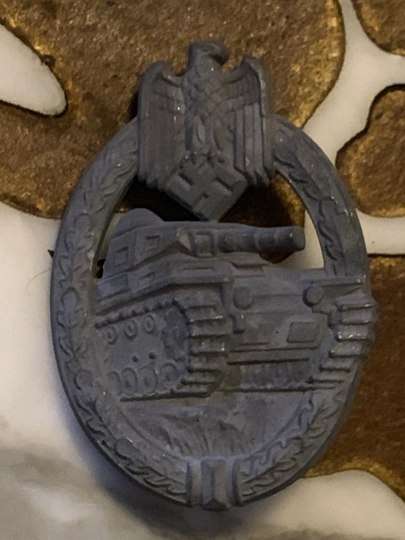WW2 GERMAN NAZI PANZER SS TANK BADGE W/ MAKER MARKS: WW2 GERMAN NAZI PANZER SS TANK BADGE WITH MAKER MARKS. IN EXCELLENT SHAPE AND MINT OVERALL CONDITION. HAS A GREAT OVERALL PATINA. VERY FINE DETAILS. A RARE FIND AND AN EXCELLENT ADDITION TO YOUR COLLE