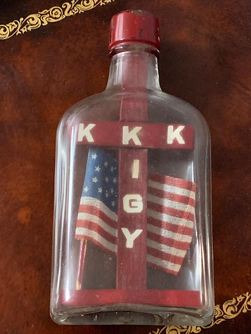 RARE KKK KIGY KLAN MEMBERS PERSONAL ITEM: RARE KKK KIGY KLAN MEMBERS PERSONAL ITEM. HAS A CROSS INSIDE A BOTTLE. WAS PROBABLY MADE BY THE KLAN MEMBER AS HIS PERSONAL ITEM. A RARE FIND. HAS A GREAT OVERALL PATINA. A RARE FIND AND AN EXCELLENT 
