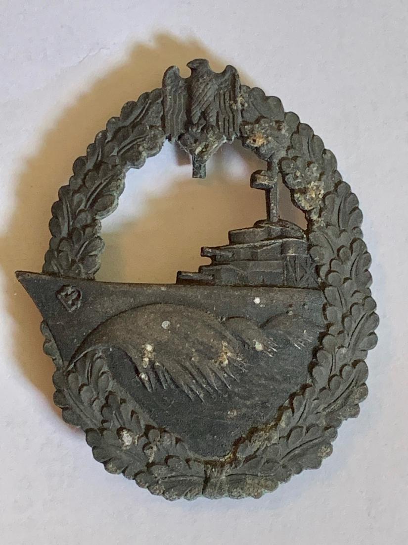 WW2 GERMAN NAZI KREIGSMARINE DESTROYER BADGE: WW2 GERMAN NAZI KREIGSMARINE DESTROYER BADGE. The award is complete with its hinge and top hook, which is in working order. The badge has toned over the years, to a lemon yellow wreath and oxidised da