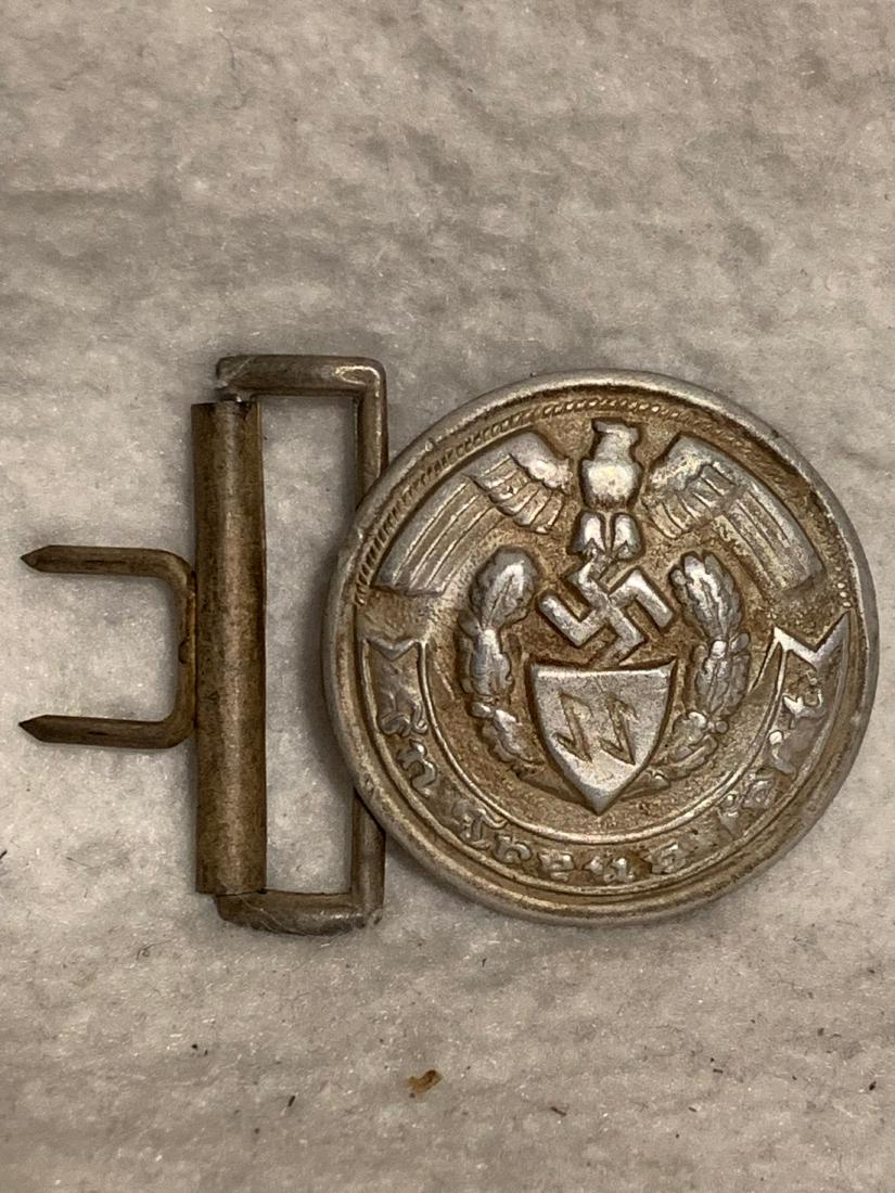 RARE WW2 GERMAN SS OFFICERS BELT BUCKLE: RARE WW2 GERMAN SS OFFICERS BELT BUCKLE. IN EXCELLENT SHAPE AND OVERALL CONDITION. HAS A BEAUTIFUL OVERALL PATINA. ON THE REAR OF THE BUCKLE ARE THE MAKER MARKS RZM. A RARE FIND AND AN EXCELLENT ADDIT