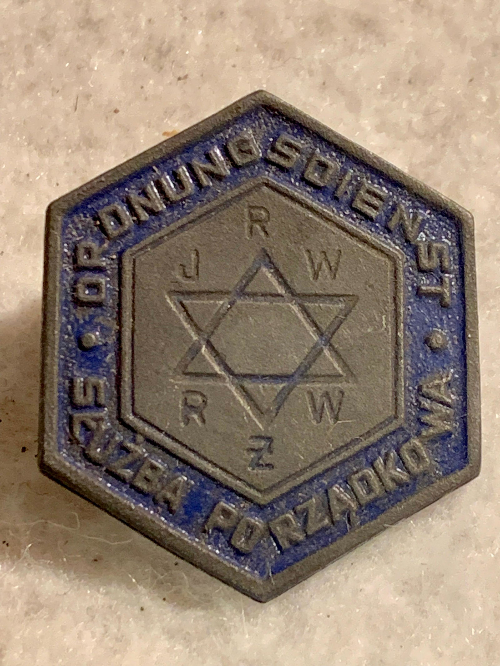 WW2 GERMAN NAZI JEWISH KAPO POLICE IDENT. PIN: WW2 GERMAN NAZI JEWISH KAPO POLICE IDENT. PIN. IN GREAT OVERALL SHAPE AND CONDITION. FROM THE AUSCHWITZ HOLOCAUST CONCENTRATION CAMP. HAS MAKER MARKS ON THE BACK - VIEW PICTURES. A VERY RARE FIND AND 