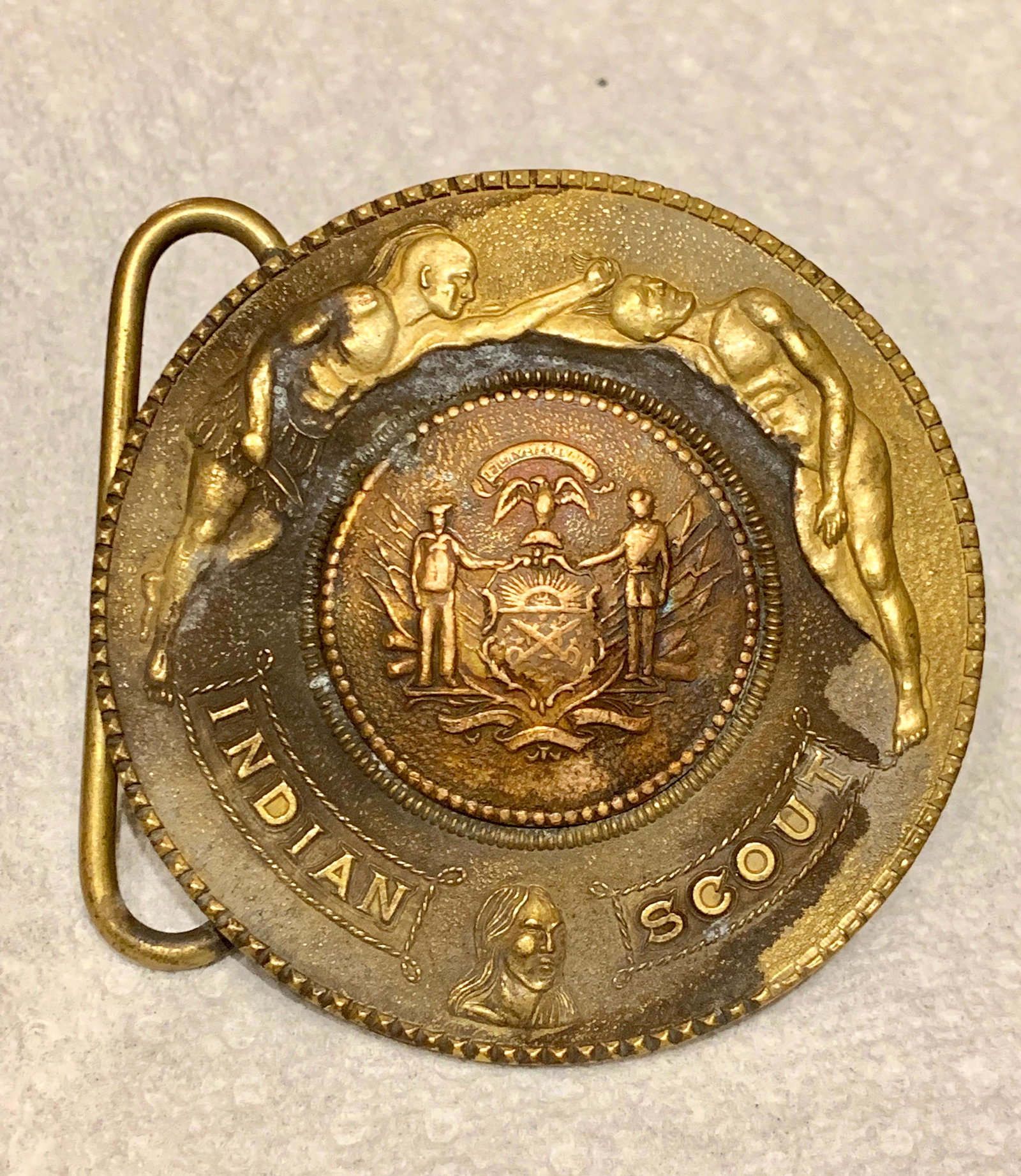RARE INDIN SCOUTS BELT BUCKLE BY TIFFANY & CO.: RARE INDIN SCOUTS BELT BUCKLE BY TIFFANY & CO. IN EXCELLENT SHAPE AND OVERALL CONDITION. HAS A BEAUTIFUL OVERALL PATINA. THIS IS A RARE FIND. WOULD MAKE A STUNNING ADDITION TO YOUR COLLECTION.