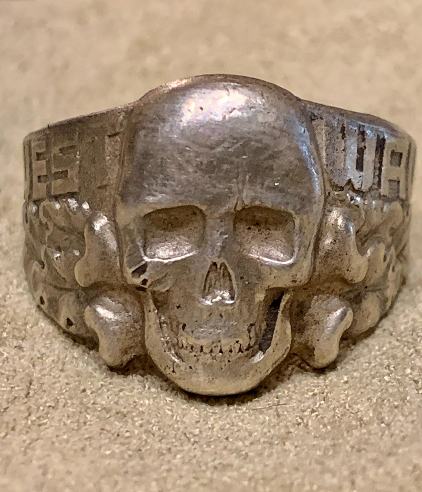WW2 GERMAN TOTENKOMPF SS OFFICERS RING STERLING SILVER: WW2 GERMAN TOTENKOMPF SS OFFICERS RING STERLING SILVER. IN EXCELLENT SHAPE AND OVERALL CONDITION. MARKED 800 - SILVER. THIS IS IN MINT CONDITION. THE FRONT OF THE RING HAS THE WRITING WEST WALL WITH T