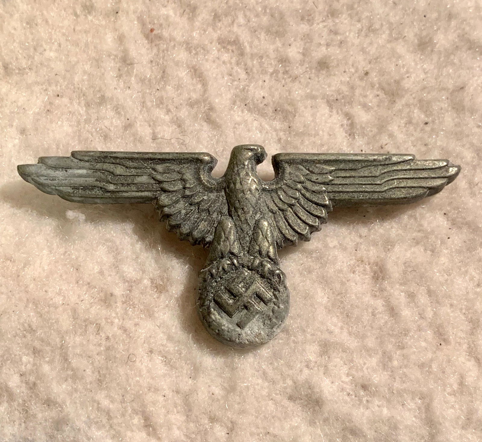 WW2 GERMAN WAFFEN SS EAGLE HAT INSIGNIA: WW2 GERMAN WAFFEN SS EAGLE HAT INSIGNIA. HAS THE SS RZM MAKER MARKS ON THE BACK. HAS A BEAUTIFUL OVERALL PATINA. A RARE AUTHENTIC EXAMPLE OF THE TIME PERIOD. A GREAT FIND!