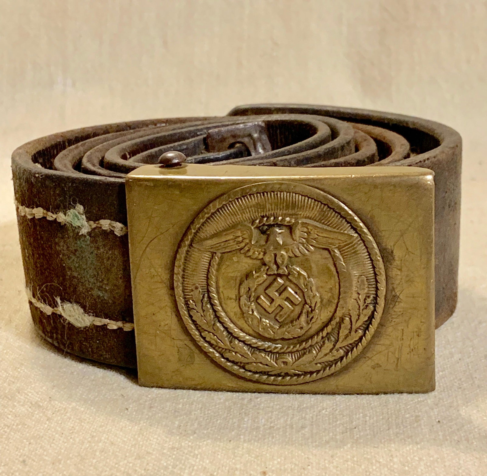ORIG. WW2 GERMAN SA BELT BUCKLE W/ BELT - COMPLETE: ORIG. WW2 GERMAN SA BELT BUCKLE W/ BELT - COMPLETE. IN EXCELLENT SHAPE AND OVERALL CONDITION WITH A BEAUTIFUL OVERALL PATINA. COMES COMPLETE. THIS WAS BROUGHT BACK HOME BY A VET AND WAS GIFTED TO A FA