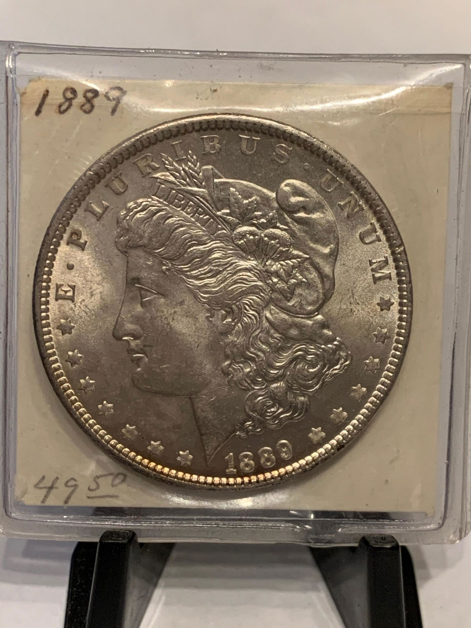 1889 MORGAN SILVER DOLLAR: 1889 MORGAN SILVER DOLLAR. A GREAT ADDITION TO YOUR WATCH COLLECTION.