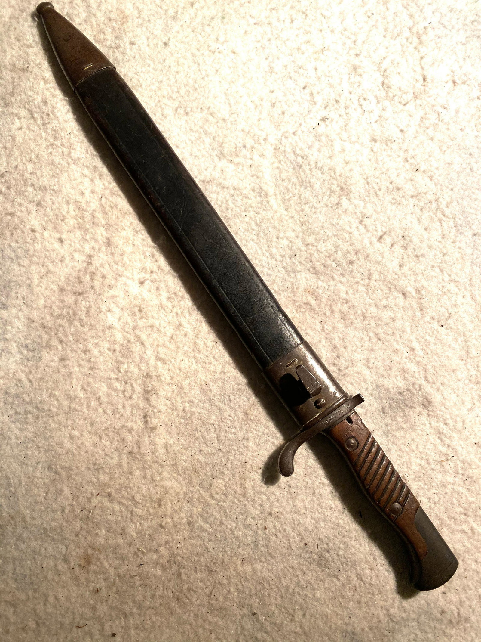 RARE NUMBERED WW2 GERMAN SAWBACK BAYONET: RARE NUMBERED WW2 GERMAN SAWBACK BAYONET. THIS IS A GORY AND VICIOUS LOOKING GERMAN BAYONET WITH SAWBACK BLADE. THIS IS A RARE NUMBERED SAWBACK BAYONET - VIEW PICTURES. BLADE HAS MAKER MARKS G. CHAENE