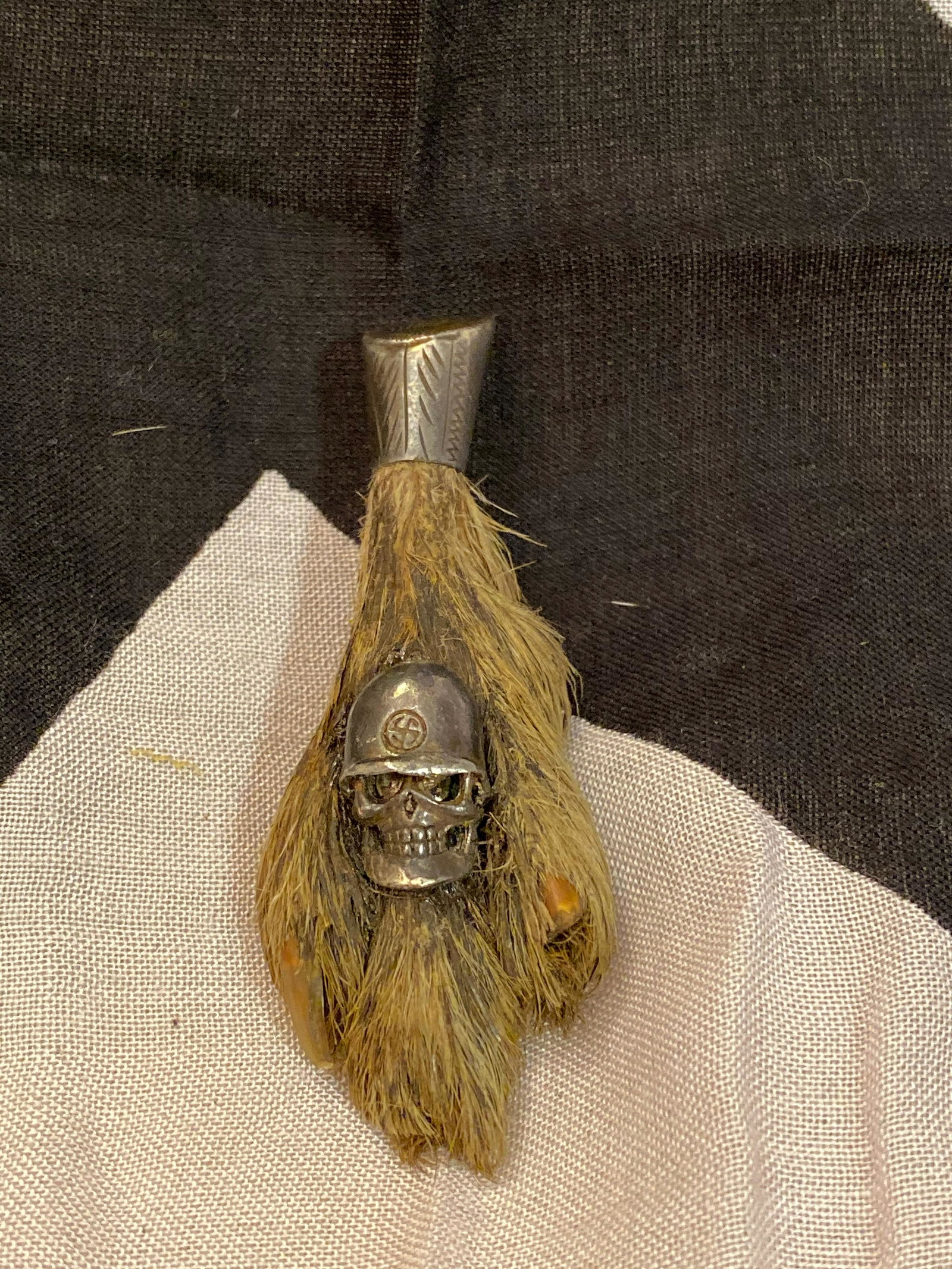 RARE WW2 GERMAN SS SOLDIERS PIN: RARE WW2 GERMAN SS SOLDIERS PIN. RARE FIND. MADE OUT OF AN ANIMALS FOOT. PROBABLY MADE BY A GERMAN SOLDIER? TRENCH ART? WE AREN'T SURE. A RARE ADDITION TO YOUR COLLECTION.