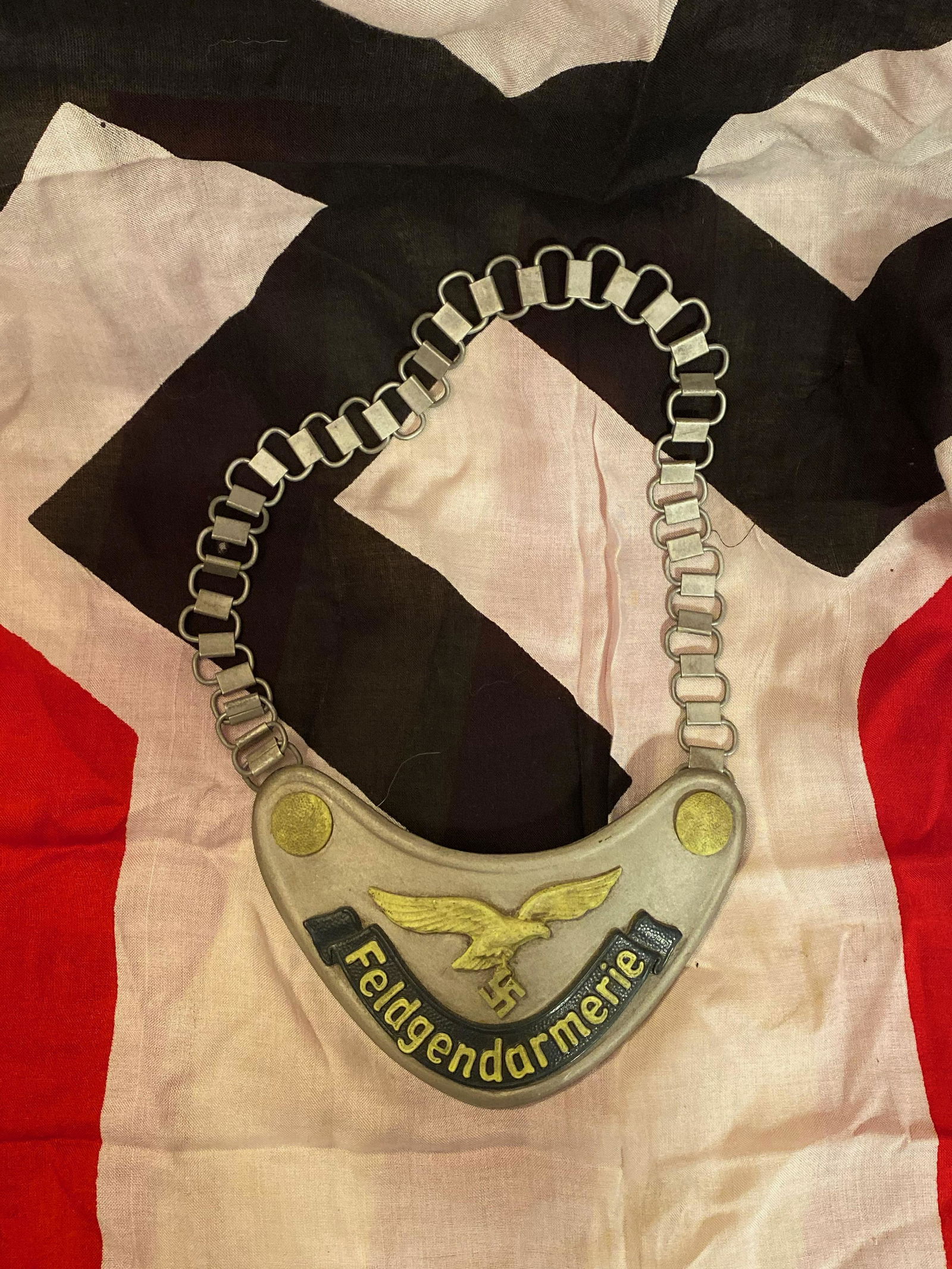 RARE WW2 GERMAN NAZI FELDGENDARMERIE GORGET W/ MAKER: RARE WW2 GERMAN NAZI FELDGENDARMERIE GORGET. HAS MAKER MARKS D.R.G.M. ON THE BACK - VIEW PICTURES. IN EXCELLENT SHAPE AND OVERALL CONDITION WITH A BEAUTIFUL OVERALL PATINA. THIS IS ONE OF THE NICEST G
