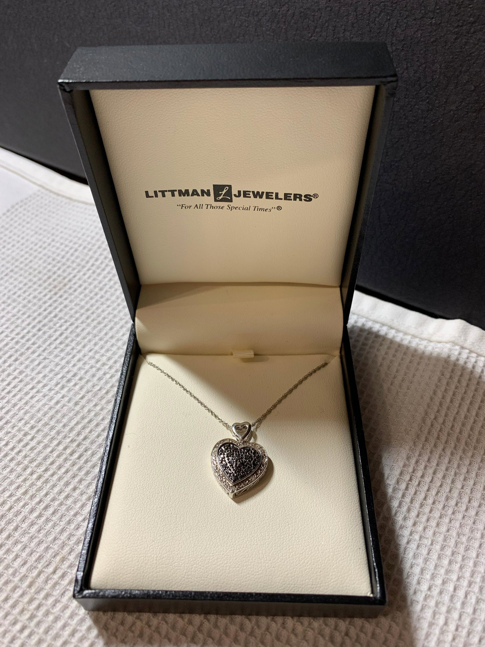 LITTMAN JEWELERS STERLING SILVER HEART NECKLACE: LITTMAN JEWELERS STERLING SILVER HEART NECKLACE. MIGHT BE BLACK AND WHITE DIAMONDS? WE ARE NOT SURE. PLEASE VIEW PICTURES.