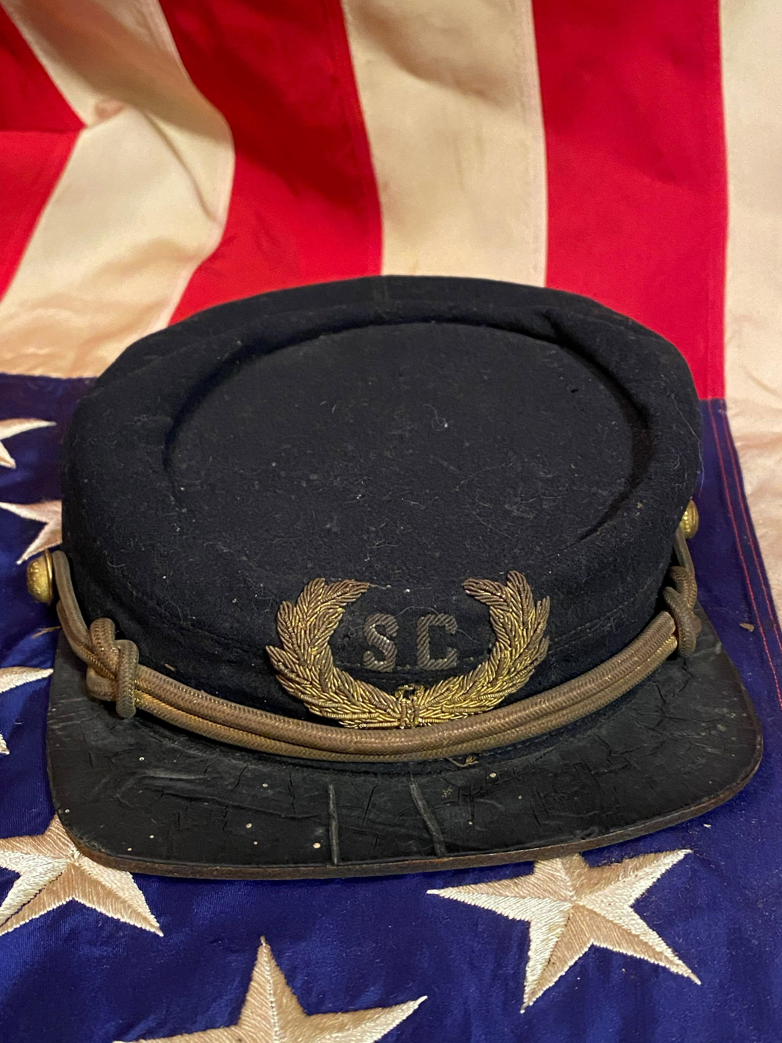 SCARCE CIVIL WAR CONFEDERATE SOUTH CAROLINA KEPI: SCARCE CIVIL WAR CONFEDERATE SOUTH CAROLINA OFFICERS KEPI. THIS BEAUTIFUL KEPI IS IN MINT OVERALL SHAPE AND CONDTION. HAS A GREAT OVERALL UNTOUCHED PATINA. IN GREAT CONDITION FOR BEING 150+ YEARS OLD.