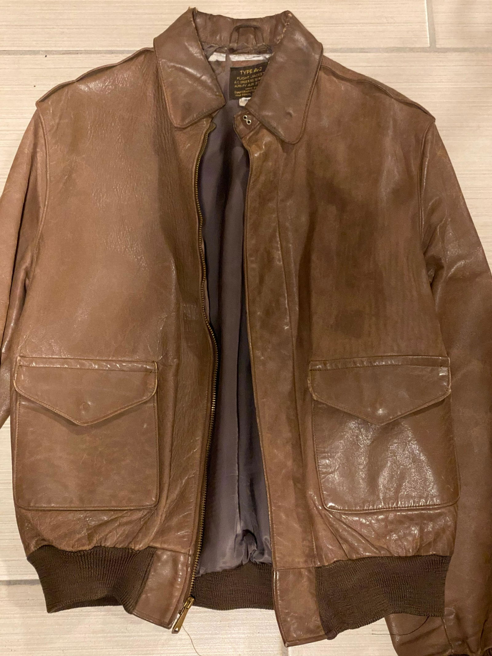 WW2 U.S. TYPE A-2 BOMBER JACKET WITH DECORATIONS: WW2 U.S. TYPE A-2 BOMBER JACKET WITH DECORATIONS. HAS A BEAUTIFUL OVERALL PATINA. THIS JACKET IS BEAUTIFULLY DECORATED ON THE BACK. IT IS IN GREAT OVERALL SHAPE AND CONDITION FOR ITS AGE WITH A BEAUTI