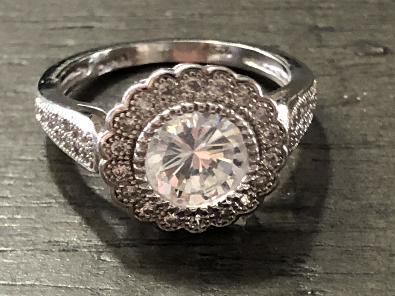 CUSTOM STERLING SILVER CZ WEDDING RING: CUSTOM STERLING SILVER CZ WEDDING RING. IN MINT OVERALL SHAPE AND CONDITION. A GREAT ADDITION TO YOUR COLLECTION.