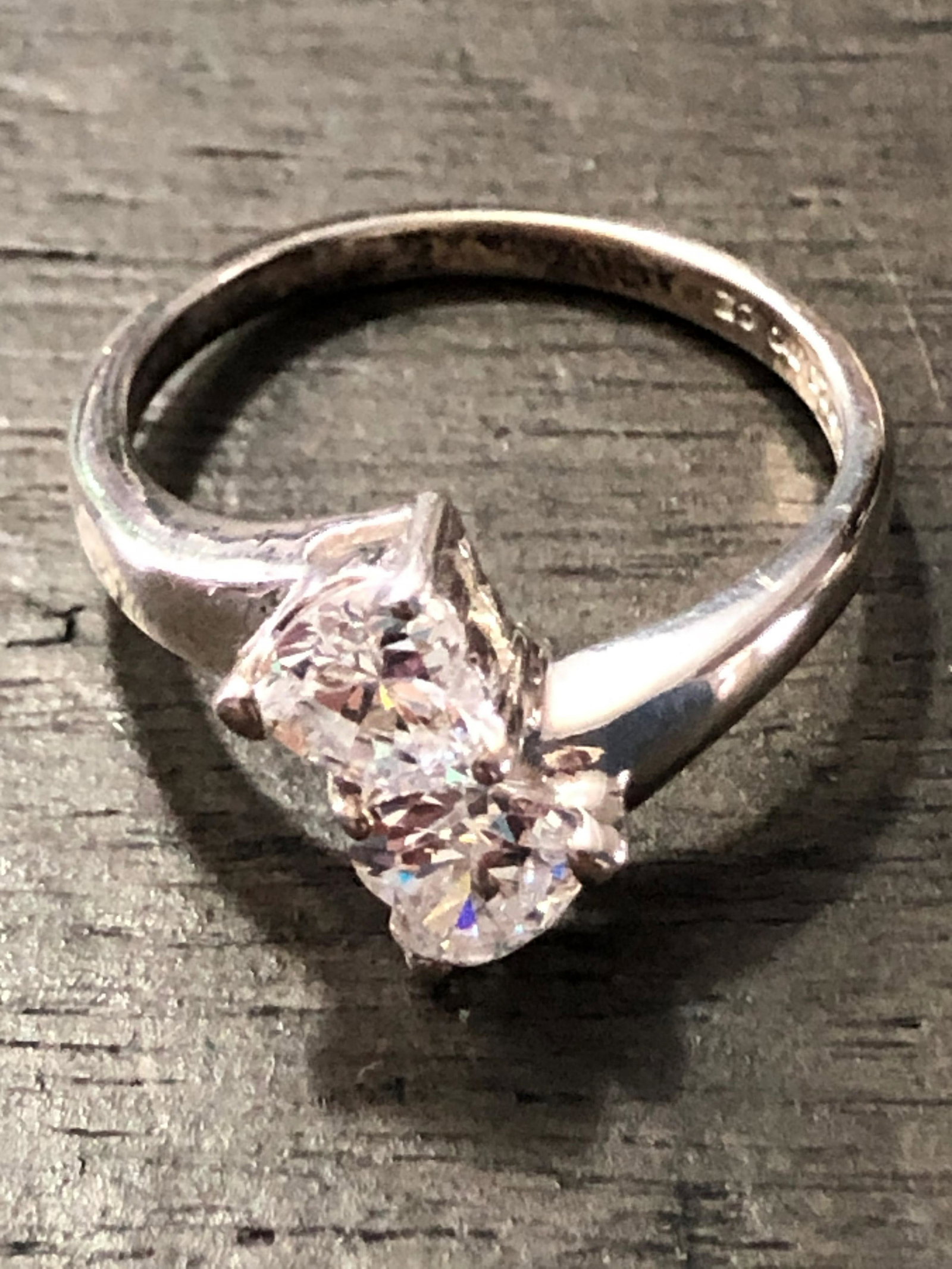 CUSTOM STERLING SILVER BYPASS CZ WEDDING RING: CUSTOM STERLING SILVER BYPASS CZ WEDDING RING. IN MINT OVERALL SHAPE AND CONDITION. A GREAT ADDITION TO YOUR COLLECTION.