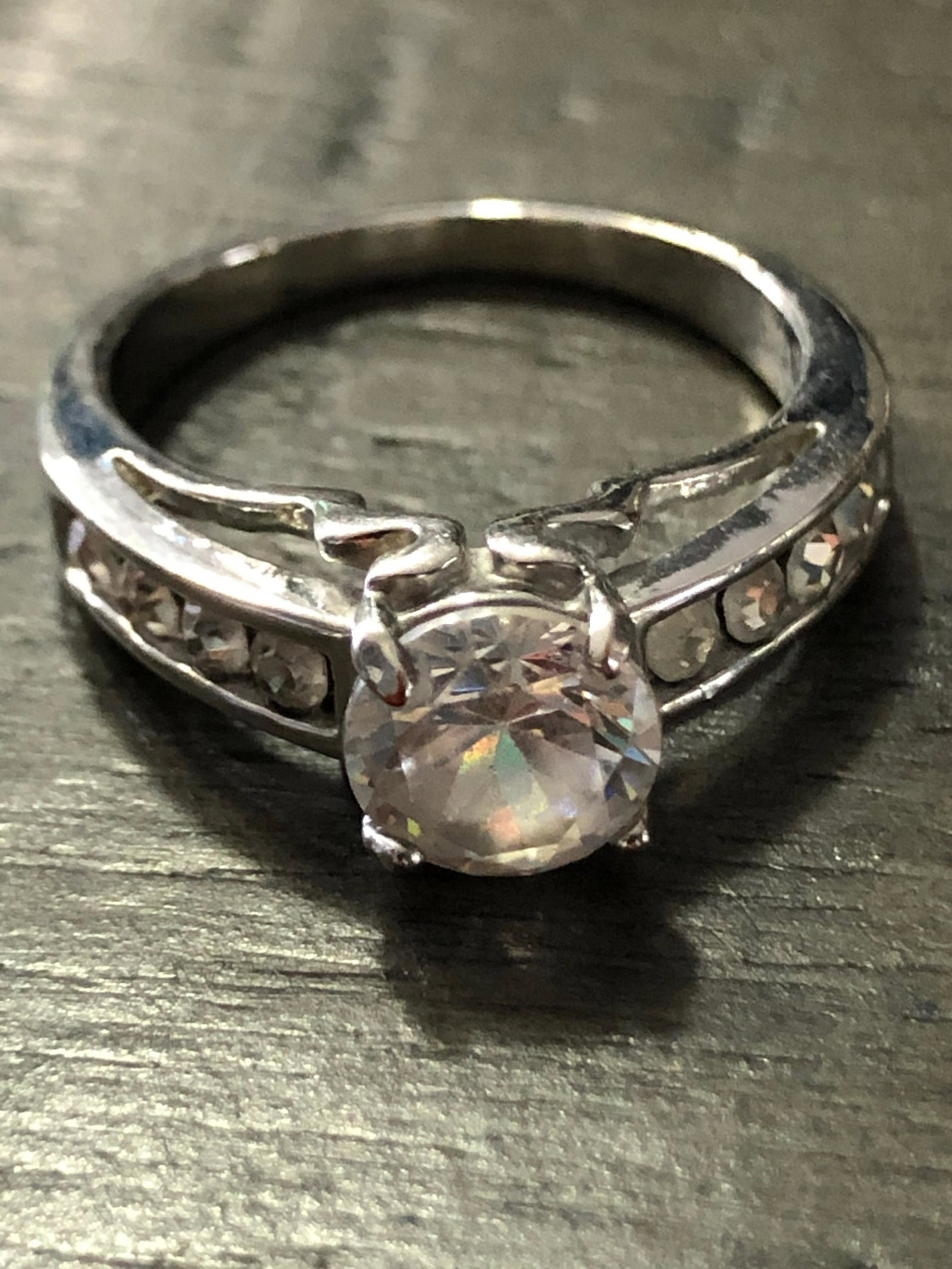 CUSTOM STERLING SILVER CZ WEDDING RING: CUSTOM STERLING SILVER CZ WEDDING RING. IN MINT OVERALL SHAPE AND CONDITION. A GREAT ADDITION TO YOUR COLLECTION.