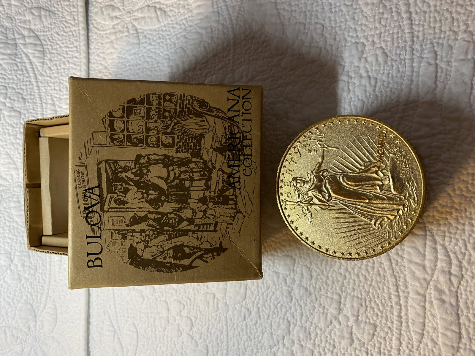 BULOVA AMERICANA COLLECTION DESK CLOCK: BULOVA AMERICANA COLLECTION DESK CLOCK. MIGHT NEED NEW BATTERIES. COMES IN THE ORIG. BOX.